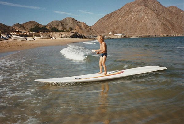 Byron Kay playing on a windsurfing board