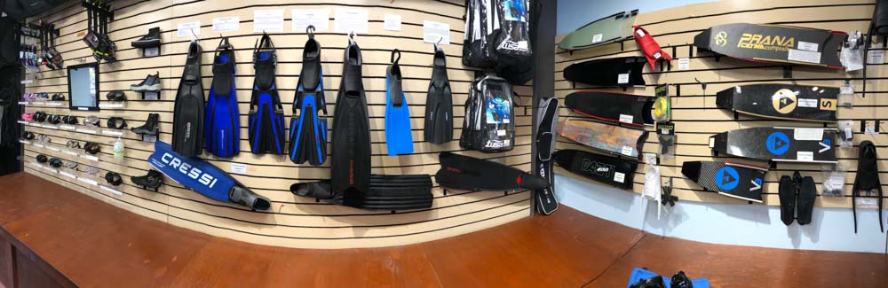 freediving fins and scuba diving fins on display wall