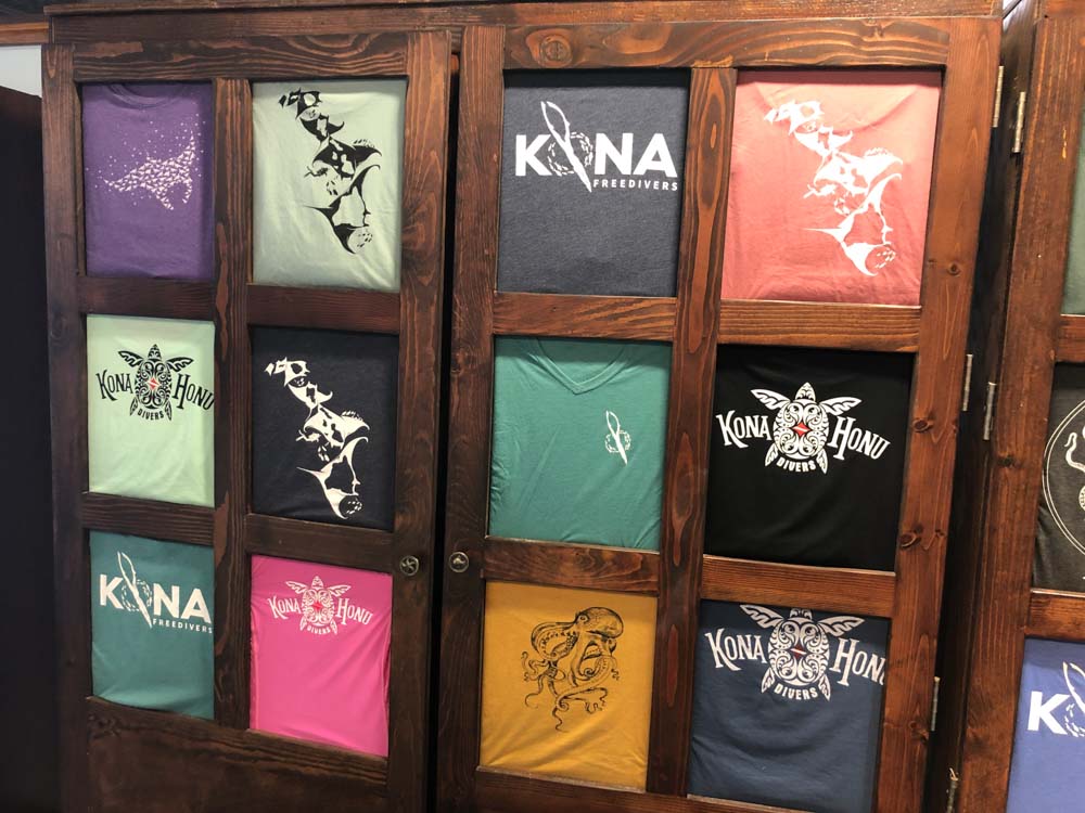 t shirt display case in dive shop