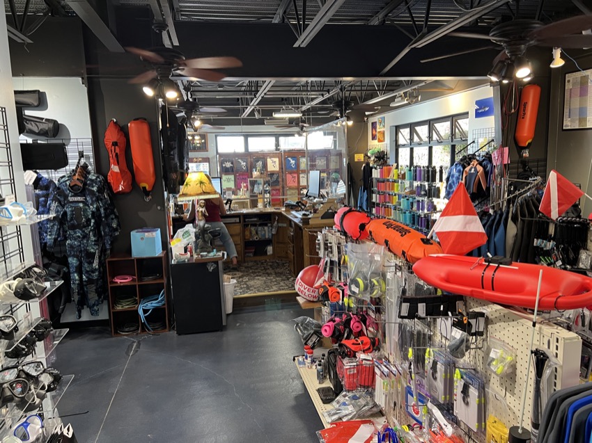 inside of dive shop with products on display in foreground