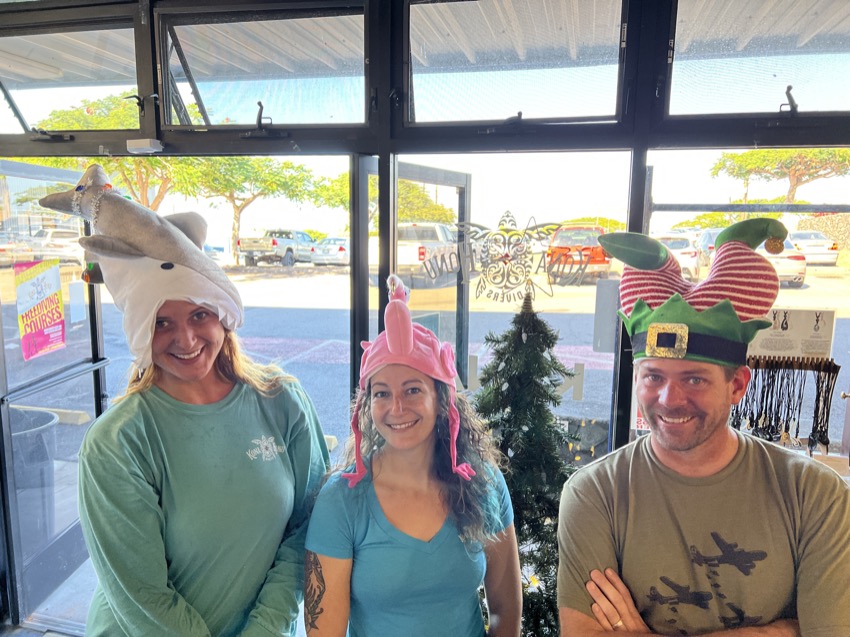 dive shop staff wearing Christmas hats