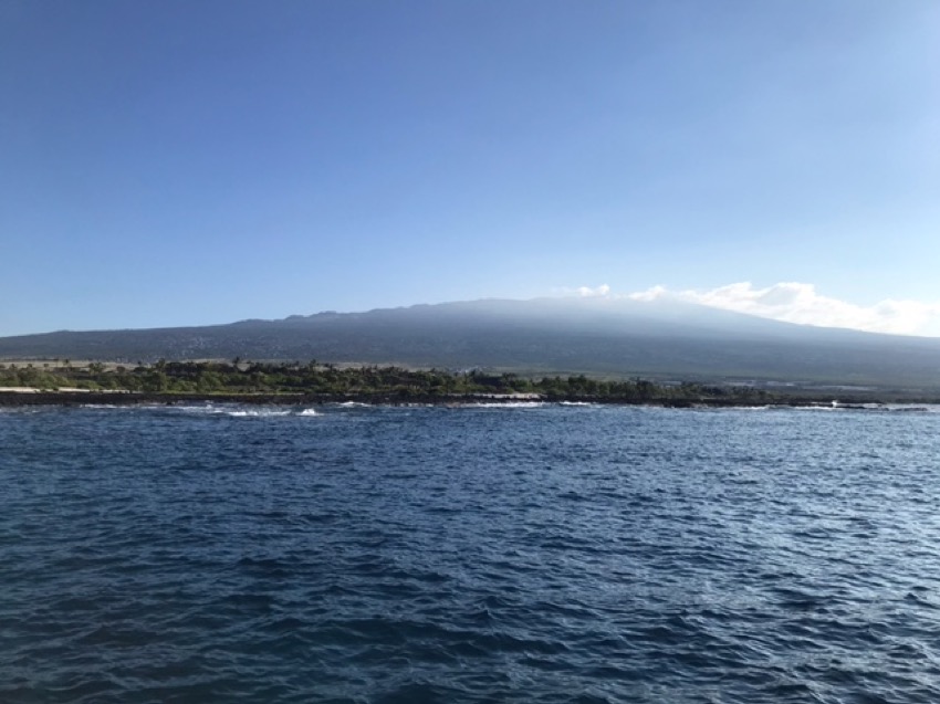 view of the kona coast from a dive boat including hualalai