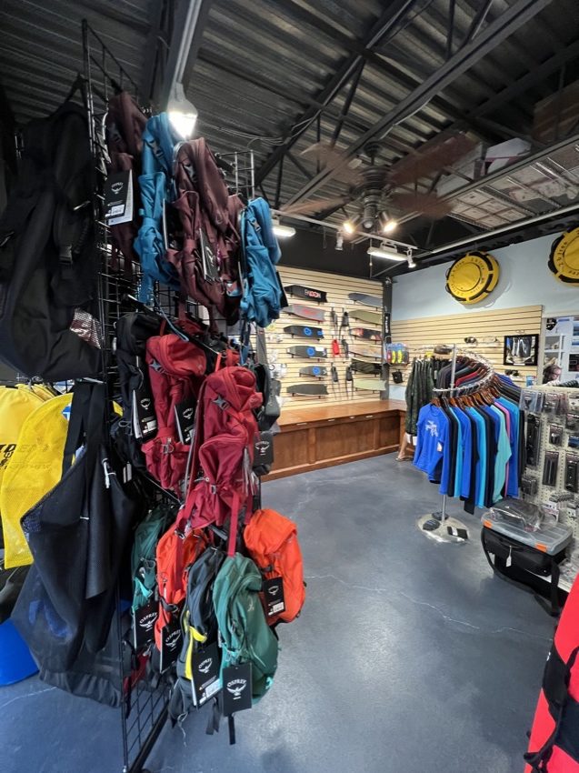 bags and other products displayed inside a dive shop