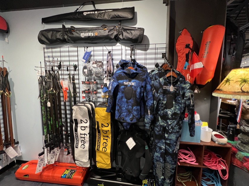 spearfishing products displayed inside a dive shop