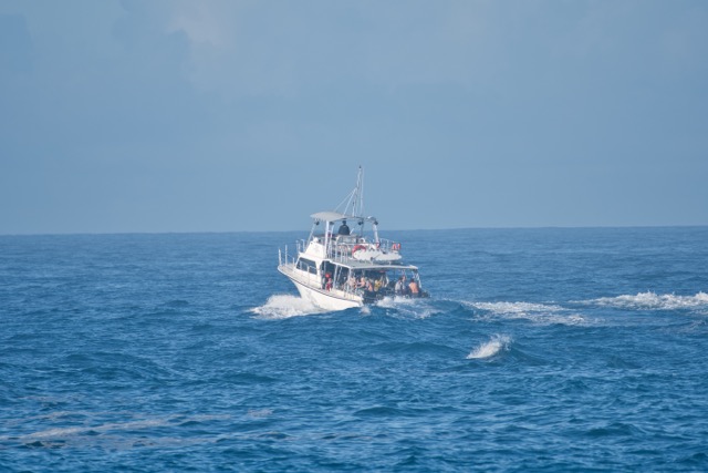 dive boat moving away