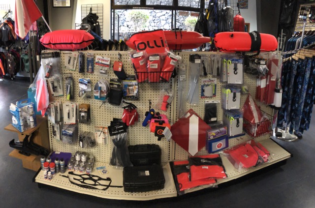 inside dive shop display with products like floats and miscellaneous accessories