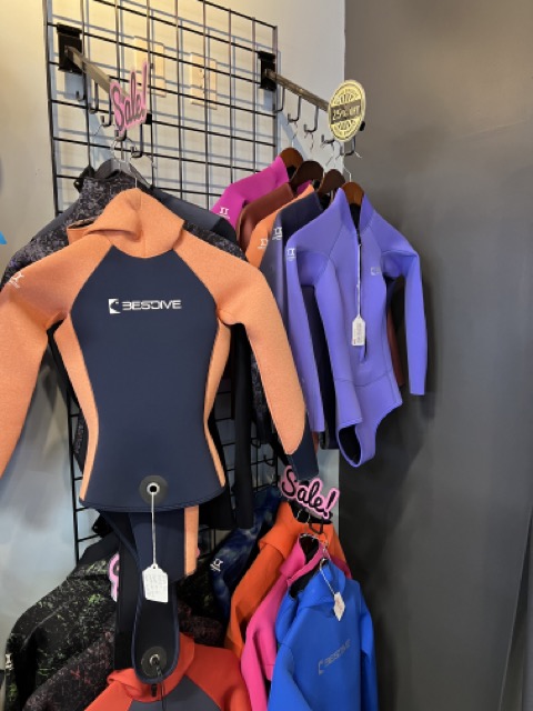 wetsuits inside a dive shop