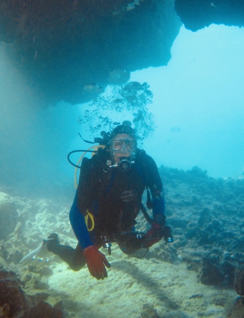 diver under an overhang