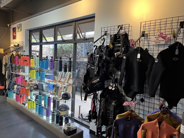 inside a dive shop wetsuits