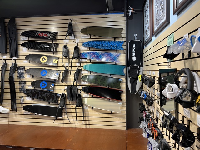 fins and masks inside a dive shop