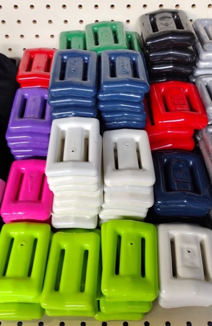 a pile of colorful rubber coated dive weights for weight belts