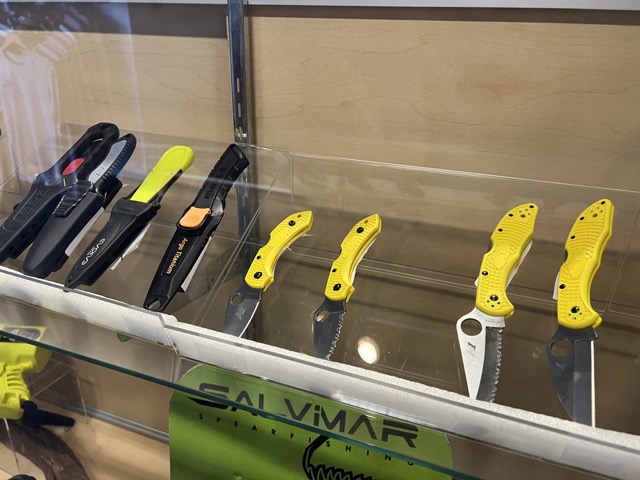 knives on display inside a dive shop