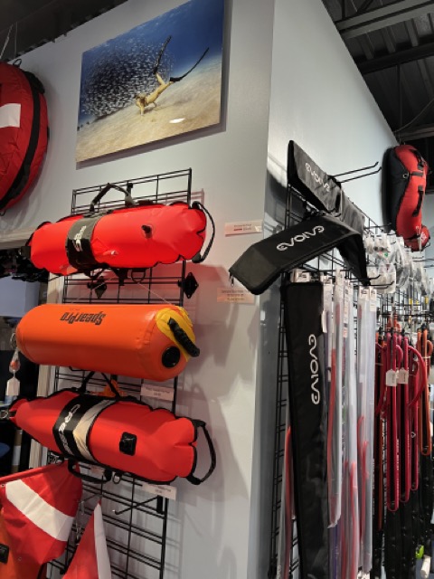 floats and spears on display in a kona dive shop