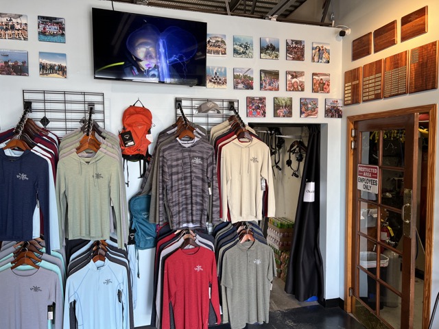 dive shop entrance with shirts on display